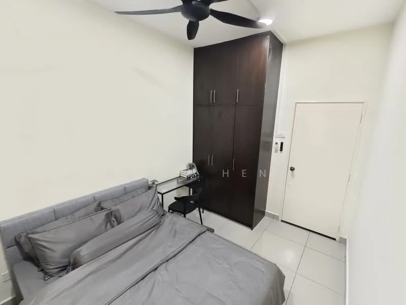 Bedroom features: queen-size bed with grey bedding, upholstered headboard, dark wood wardrobe with multiple doors, small black study desk, chair, white walls, grey tiled flooring, ceiling fan, door to hallway; style: modern.