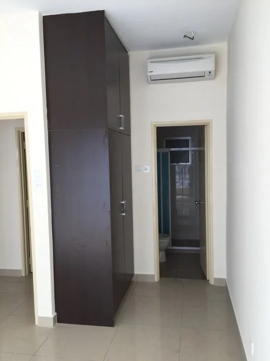 Room features: cream painted walls, glossy tile flooring, built-in wardrobe with dark wood finish, wall-mounted split AC, doorway leading to bathroom, doorway leading to another room; style: modern.