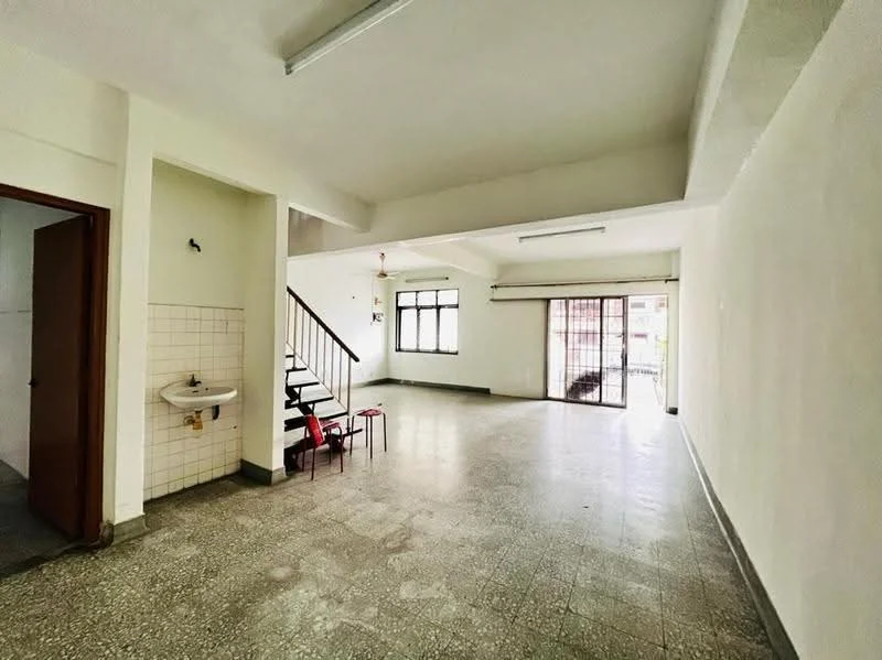 Living features: white painted walls, grey tiled flooring, large windows with natural light, sliding glass door, ceiling lights, open layout, staircase leading to upper floor, sink with faucet, space for furniture arrangement, neutral decor. Room features: white painted walls, grey tiled flooring, sink with faucet, doorway leading to another room.