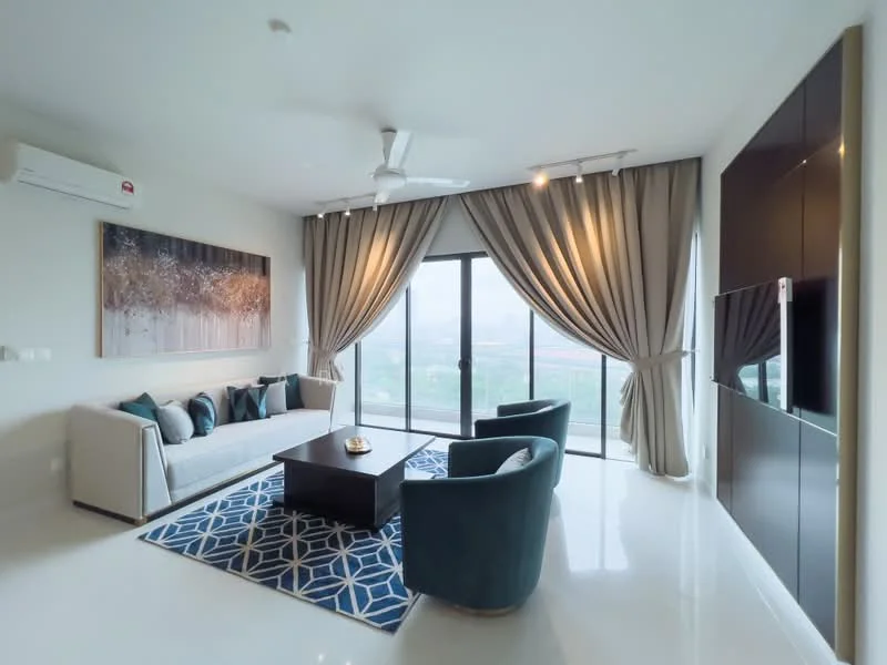 Living features: 3-seater fabric sofa in light grey, 2 armchairs in teal, coffee table with dark wood finish, area rug with geometric pattern in blue and white, floor-to-ceiling windows, sliding glass door, sheer curtains, blackout curtains, wall-mounted TV, built-in cabinetry, recessed downlights, 5-blade ceiling fan with light, white painted walls, polished tile flooring; style: modern; view: city.