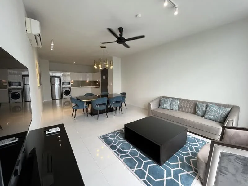 Living features: 3-seater fabric sofa in beige, coffee table in black, area rug with geometric pattern, wall-mounted TV, ceiling fan with light, recessed downlights, white painted walls, tile flooring, large windows, open layout to dining area; style: modern. Dining features: 6-seater dining table, upholstered dining chairs in blue, pendant lighting above table, open layout to living area, white painted walls, tile flooring; style: modern. Kitchen features: stainless-steel fridge, built-in oven, freestanding washing machine, white cabinetry, open shelving, countertop with bar seating, tile backsplash, tile flooring; style: modern.
