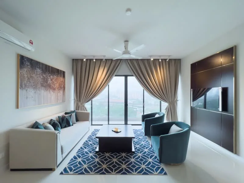 Living features: 3-seater fabric sofa in light beige, 2 accent chairs in teal, coffee table with dark wood finish, area rug with geometric pattern in blue and white, floor-to-ceiling windows, sheer curtains, recessed downlights, 5-blade ceiling fan with light, wall-mounted TV, decorative artwork on wall; style: modern; view: city.