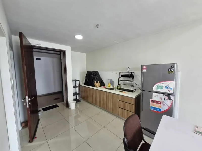 Kitchen features: white painted walls, glossy tile flooring, wood cabinetry, white countertop, stainless-steel fridge, black wire shelving, kitchen sink, single-bowl stainless-steel sink, chrome faucet, dining table with chairs; style: modern.
