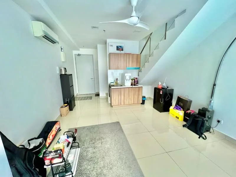 Living features: white painted walls, glossy tile flooring, 5-blade ceiling fan with light, wall-mounted split AC, sofa, coffee table, area rug, open shelving unit, staircase, kitchenette with wood cabinetry, refrigerator, microwave, kettle; style: modern.