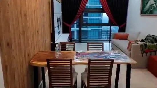 Dining features: wooden dining table, 4 wooden dining chairs, water bottle on table, wood panelled accent wall, large window with city view, curtains in dark red, sofa in orange, decorative wall art; style: modern; view: city. Living features: sofa in orange, decorative throw on sofa, wall-mounted artwork; style: modern; view: city.