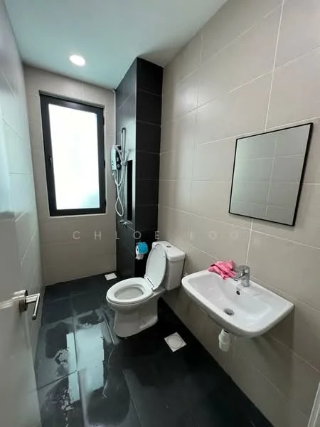 Bathroom features: black tiled flooring, light grey wall tiles, white toilet, wall-mounted basin, chrome basin mixer faucet, framed mirror, shower with wall-mounted showerhead, window for natural light, towel rack, pink towel; style: modern.