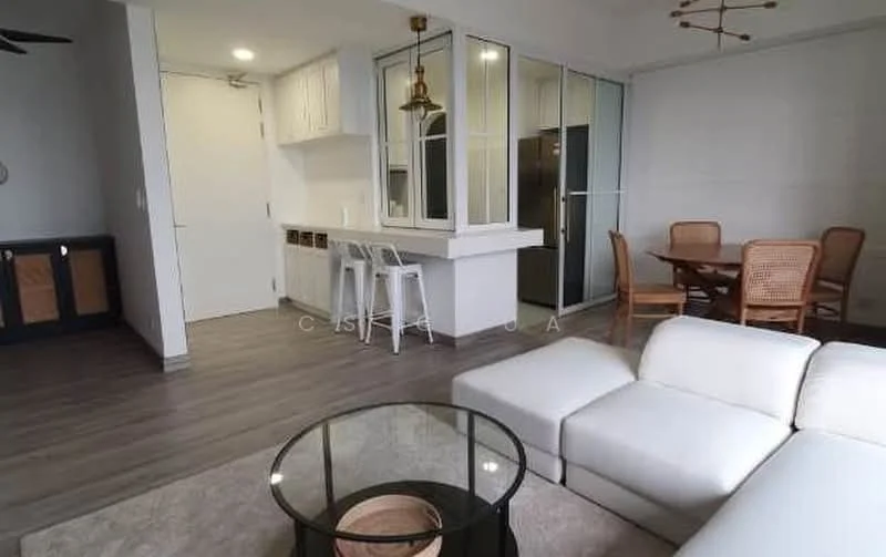 Living features: white leather sectional sofa, glass coffee table, wood dining table with rattan chairs, pendant light fixture, recessed lighting, laminate flooring, floor-to-ceiling windows, open kitchen layout, bar counter with stools, white cabinetry, stainless-steel fridge; style: modern.