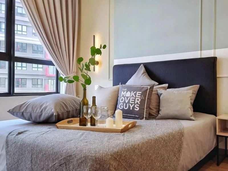 Bedroom features: king-size bed with upholstered headboard, grey bedding, decorative throw pillows, wooden bedside table, glass vase with greenery, two wine bottles, two wine glasses, decorative tray, candle, floor-to-ceiling windows, curtains in light beige, wall-mounted light fixtures, neutral wall color, textured wall panel, area rug; style: modern; view: city.