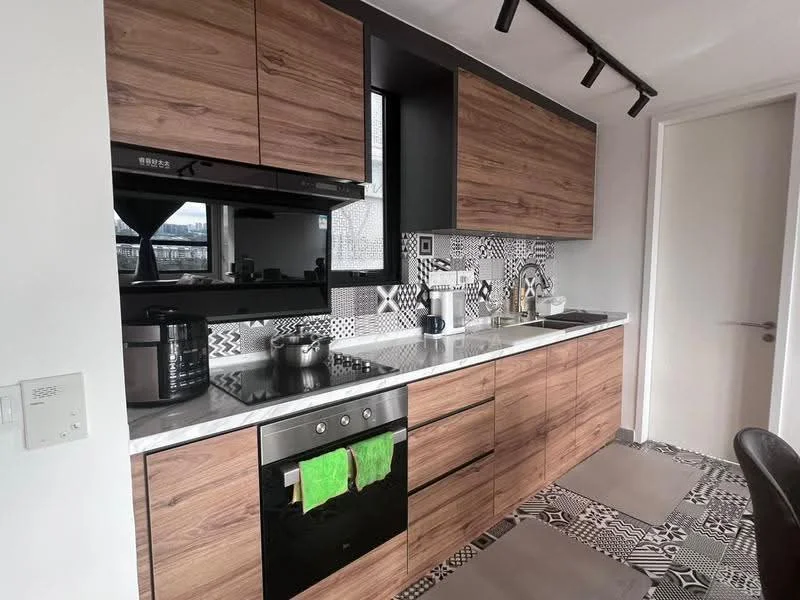 Kitchen features: wood cabinetry, black countertop, stainless-steel built-in oven, stainless-steel cooktop, black range hood, single-bowl stainless-steel sink, chrome pull-down faucet, decorative tile backsplash, textured flooring, kitchen utensils visible, microwave, coffee maker, kitchen towels, 2 kitchen mats; style: modern.