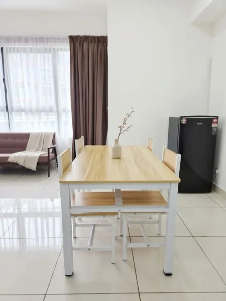 Dining features: wooden dining table with white legs, 4 wooden dining chairs, vase with decorative branches, large window with sheer curtains, grey sofa in background, white tiled flooring, brown curtains, black fridge; style: modern.