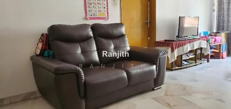 Living features: 3-seater leather sofa in dark brown, wall-mounted TV, TV console, decorative tablecloth, marble tile flooring, white painted walls, curtains, children's toys visible.