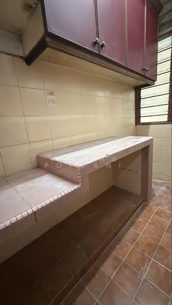 Room features: brown cabinetry with upper storage, tile backsplash, countertop with tiled surface, built-in countertop with storage underneath, brown tiled flooring, single window for natural light, cream tiled walls.