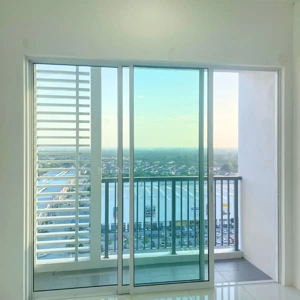 Room features: sliding glass door, floor-to-ceiling windows, white walls, grey tiled flooring, balcony with railing, city view, horizontal louvered window treatments; style: modern; view: city.