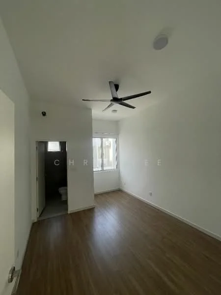 Room features: white painted walls, wooden flooring, 5-blade ceiling fan, window with natural light, door leading to bathroom, light fixture on ceiling.