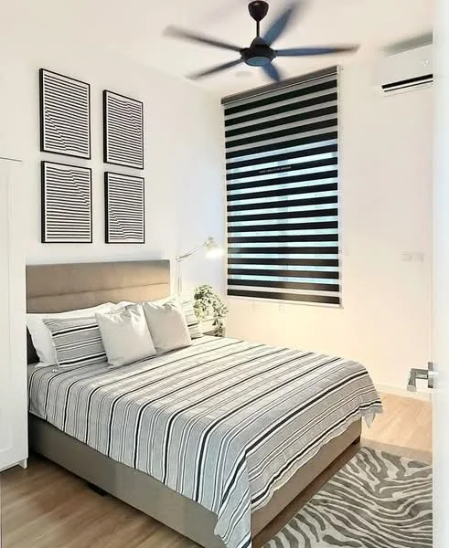 Bedroom features: king-size bed with striped bedding, upholstered headboard, 2 bedside pillows, 4 framed artworks on wall, striped roller blinds, 5-blade ceiling fan, wall-mounted air conditioning unit, wooden flooring, area rug with zebra pattern, table lamp on bedside table; style: modern.