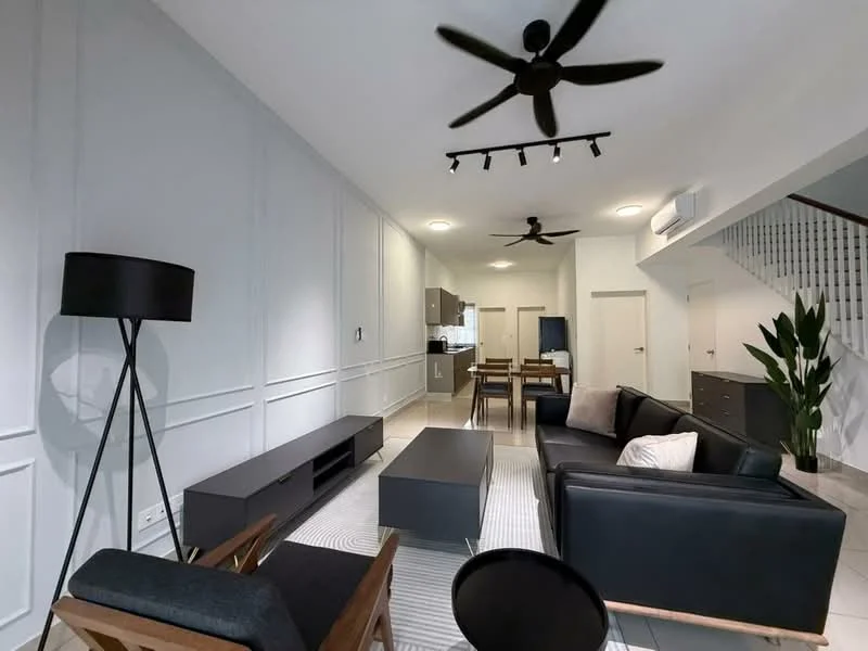 Living features: black leather sofa, 2-seater fabric sofa in beige, coffee table, area rug with geometric pattern, 5-blade ceiling fan with light, recessed LED downlights, wall-mounted TV, decorative plant in ceramic pot, white painted walls with paneling, tile flooring, dining table with chairs visible in background, open layout to kitchen, staircase visible in background; style: modern.