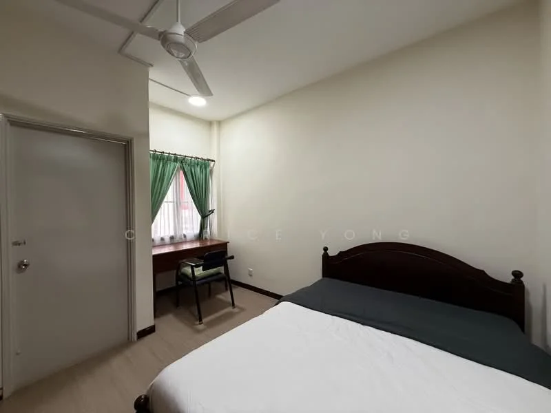 Bedroom features: queen-size bed with dark wood headboard, white bedding, wooden flooring, green curtains, desk with chair, window with natural light, ceiling fan, light-colored painted walls, door to hallway; style: minimalist.