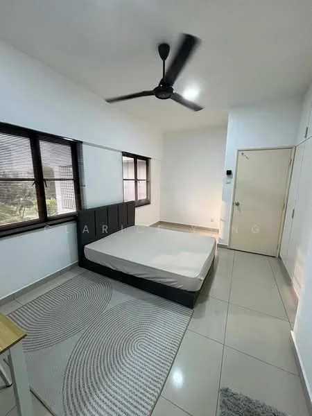 Bedroom features: white painted walls, grey tiled flooring, 5-blade ceiling fan, large windows with black frames, area rug with circular pattern, bed frame without mattress, wooden bedside table, door with white finish; style: modern; view: garden.