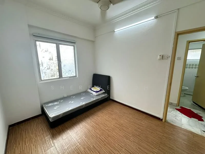 Bedroom features: single bed with mattress, white painted walls, wooden flooring, ceiling fan, window with sheer curtains, light fixture on ceiling, door leading to bathroom, decorative crown moulding; style: minimalist.