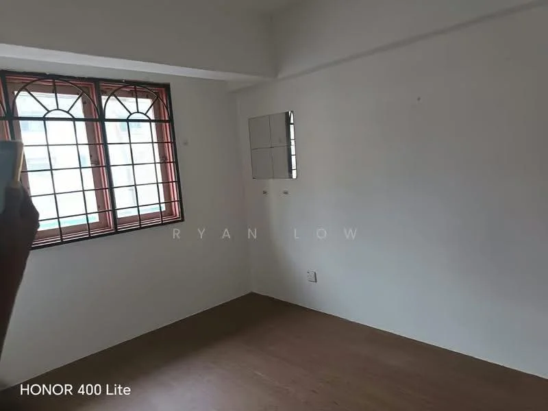 Room features: white painted walls, wooden flooring, two windows with grid design, mirror on wall, light fixture on ceiling, no visible furniture.