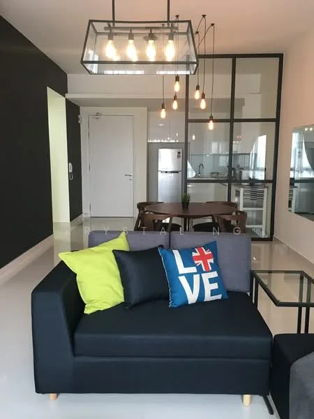 Living features: 3-seater fabric sofa in black, decorative cushions in blue and green, pendant light fixture with multiple bulbs, white tiled flooring, grey accent wall, glass partition separating kitchen, wall-mounted TV, dining table with chairs visible in background; style: modern.