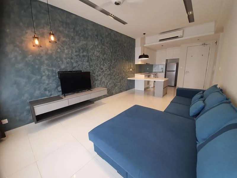 Living features: L-shape sectional sofa in blue, flat-screen TV on media console, media console in light wood, pendant lighting with exposed bulbs, recessed ceiling lights, white tiled flooring, feature wall with textured blue finish, open kitchen layout, kitchen island with seating, stainless-steel refrigerator, built-in kitchen cabinetry, wall-mounted air conditioning unit; style: modern.