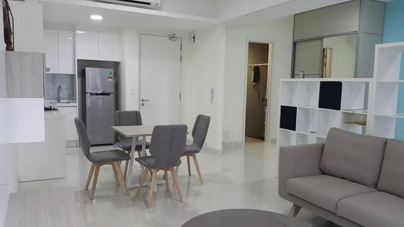 Living features: grey fabric sofa, round coffee table, 4-seater dining table, grey upholstered dining chairs, white cabinetry, stainless-steel fridge, white kitchen cabinets, white tiled flooring, recessed downlights, open layout, neutral wall colour, floor-to-ceiling windows; style: modern.