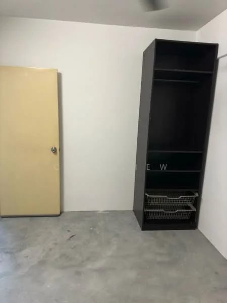 Room features: white painted walls, concrete flooring, single door with yellow finish, black storage cabinet with open shelving, wire basket storage, ceiling fan.