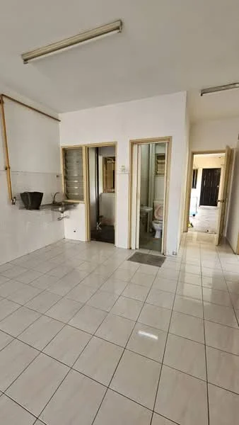 Room features: white painted walls, glossy ceramic tile flooring, kitchenette with sink, wooden cabinetry, doorway to bathroom, doorway to additional room, fluorescent ceiling lights, neutral color scheme; style: minimalist.