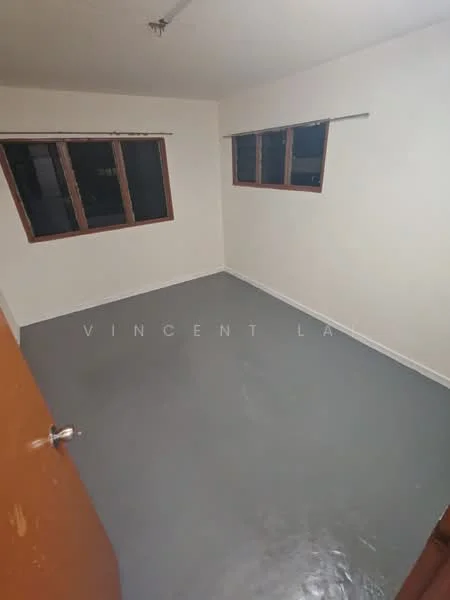 Room features: white painted walls, grey vinyl flooring, two windows with wooden frames, roller blinds on windows, single wooden door.