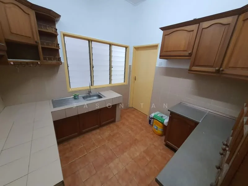 Kitchen features: brown wooden cabinetry, stainless-steel sink, chrome faucet, tile backsplash, ceramic tile flooring, countertop with grey surface, window with horizontal slats, door leading to another room, light-colored walls, storage shelves above sink; style: traditional.