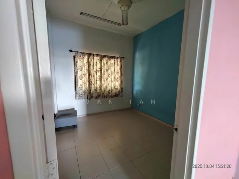 Room features: light blue painted walls, cream painted walls, tiled flooring, window with floral curtains, ceiling fan, corner sofa, natural light from window.