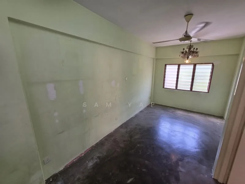 Room features: green painted walls, concrete flooring, ceiling fan, chandelier, three windows with wooden frames.