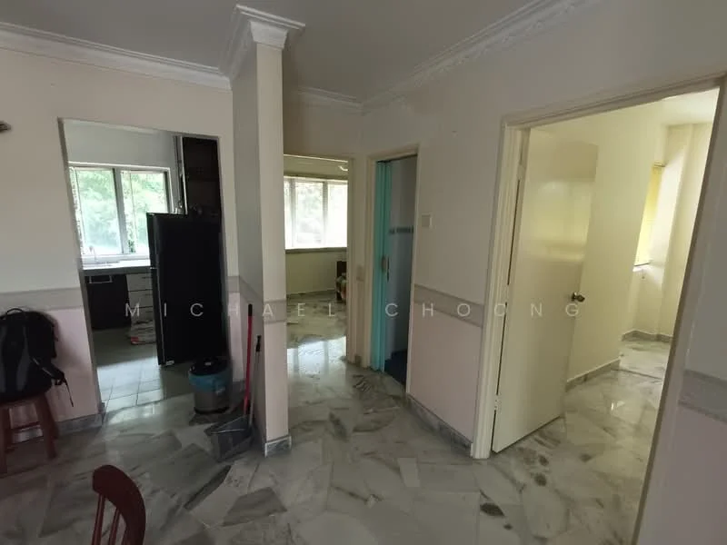 Room features: marble flooring, white painted walls, crown moulding, large windows, doorway leading to another room, kitchen area visible in background, light-colored door, light fixture on ceiling.