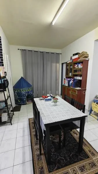 Dining features: black dining table, 4 black dining chairs, white tablecloth, ceramic vase with flowers, grey sheer curtains, white tiled flooring, built-in wooden cabinet, blue fabric tent-like structure, area rug with geometric pattern, wall-mounted shelving unit.