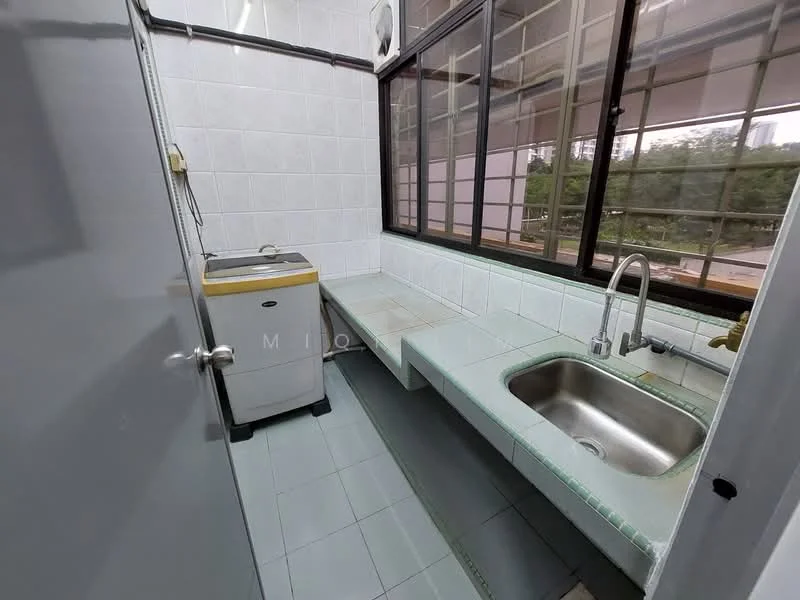 Laundry features: single-bowl stainless-steel sink, chrome pull-down faucet, white tiled walls, light green tiled countertop, grey vinyl flooring, washing machine, large window for natural light, built-in countertop space; view: garden.