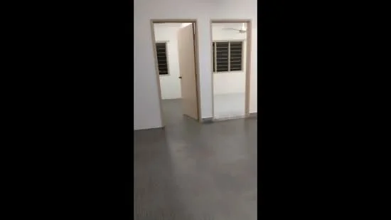 Room features: grey vinyl flooring, white painted walls, two doorways, ceiling fan, window with grilles.
