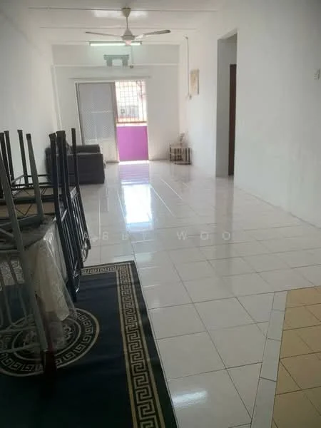 Room features: white painted walls, glossy white tile flooring, ceiling fan, large window with sheer curtains, open layout, decorative area rug with geometric pattern, furniture stacked (chairs), doorway leading to another room; style: minimalist.