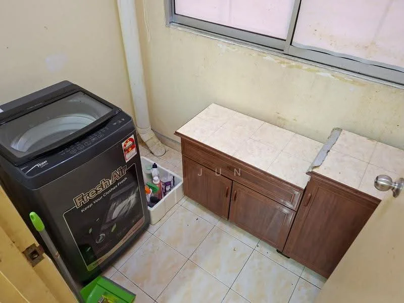 Laundry features: top-load washing machine, wooden cabinetry, tile flooring, white walls, window with natural light, plastic storage bin, cleaning supplies on countertop.
