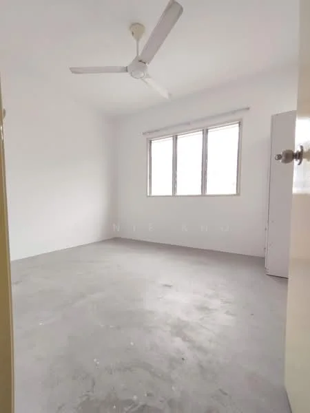 Room features: white painted walls, concrete flooring, ceiling fan, two windows, natural light, empty space, no visible furniture, neutral color scheme; style: minimalist.