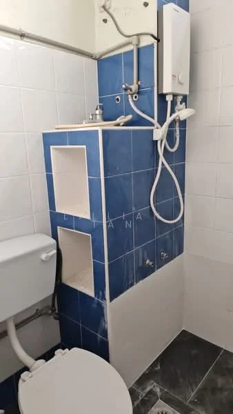 Bathroom features: white tiled walls, blue accent wall tiles, shower with handheld showerhead, wall-mounted water heater, toilet, sink with countertop, exposed plumbing, dark tiled flooring; style: modern.