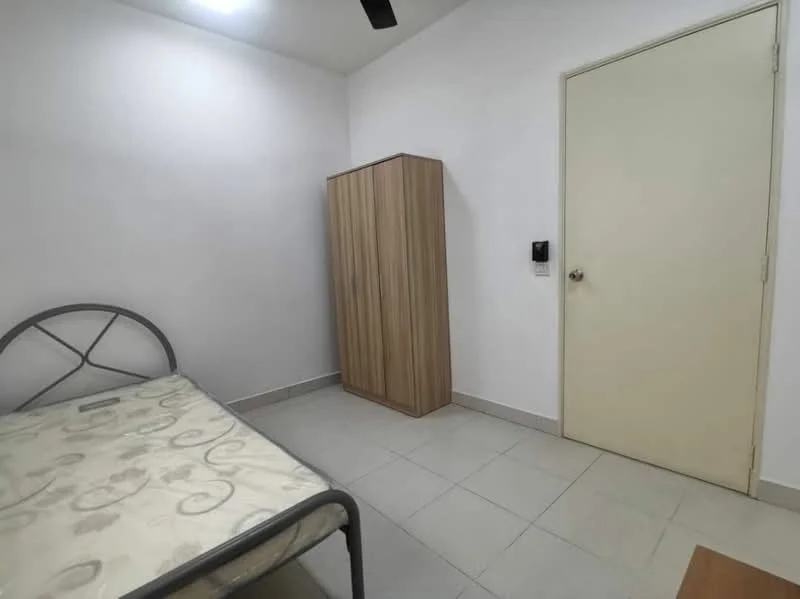 Bedroom features: single metal bed frame, mattress with floral pattern, wooden wardrobe with sliding doors, plain white walls, light grey floor tiles, ceiling light fixture, door with handle, wall-mounted intercom panel; style: minimalist.