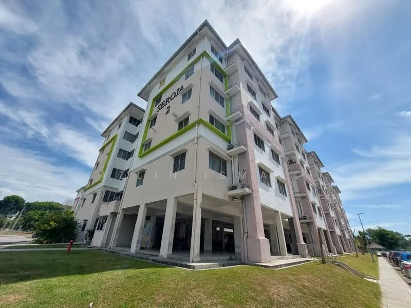Exterior type: low-rise apartment block; features: white painted facade, green accent panels, multiple storeys, ground-level parking area, concrete stairway, landscaped grass area, windows with grilles, balconies on upper floors; style: modern.
