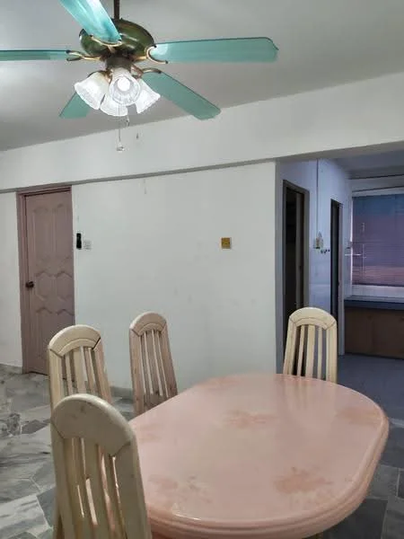 Dining features: pink oval dining table, 4 wooden dining chairs, ceiling fan with 4 blades and light, white walls, marble flooring, window with sheer curtains. Room features: doorway leading to another room, light switch on wall.