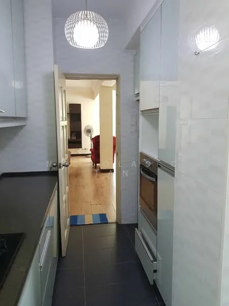Kitchen features: white cabinetry, black countertop, built-in oven, stainless-steel cooktop, grey tile flooring, pendant light fixture, door leading to hallway, wall-mounted fan, open layout to living area; style: modern.