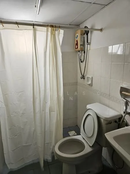 Bathroom features: white ceramic toilet, single-sink vanity with wall-mounted faucet, shower area with curtain, wall-mounted water heater, tile flooring, white tiled walls, mirror above sink, soap dispenser on wall.