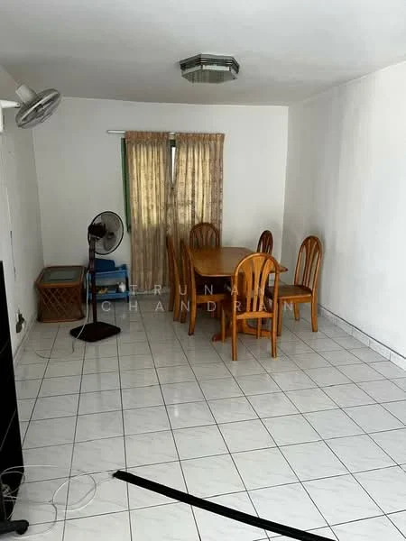 Dining features: white painted walls, glossy white tile flooring, wooden dining table, 4 wooden dining chairs, ceiling light fixture, window with sheer curtains, standing fan, bamboo storage basket, floor fan.