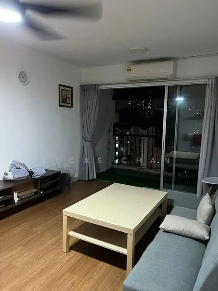 Living features: laminate flooring, white painted walls, 5-blade ceiling fan, wall-mounted air conditioning unit, sliding glass door, floor-to-ceiling windows, curtains, coffee table, 2-seater fabric sofa in grey, decorative wall clock, framed artwork, open shelving unit; style: modern; view: city.