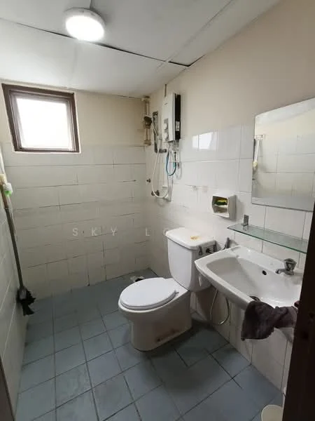 Bathroom features: white tiled walls, grey tiled flooring, one-piece toilet, single-sink vanity with glass top, framed mirror, shower with wall-mounted faucet, window for natural light, wall-mounted soap dispenser, toilet paper holder, shower curtain rod.