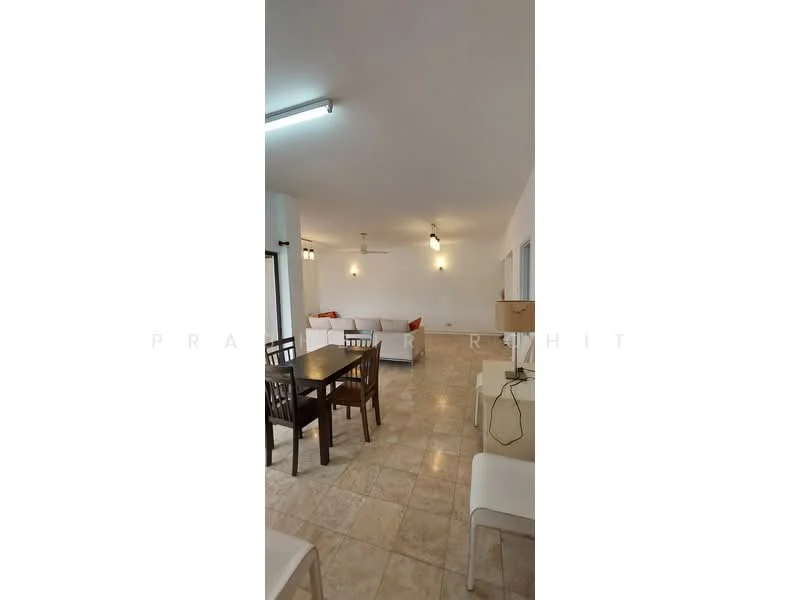 Living features: cream painted walls, tile flooring, recessed downlights, 5-blade ceiling fan, sofa in white fabric, wooden dining table, 4 wooden dining chairs, side table, large windows, natural light, open layout; style: modern.